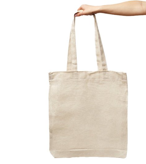 Holding PackQueen plain calico tote bag by handle